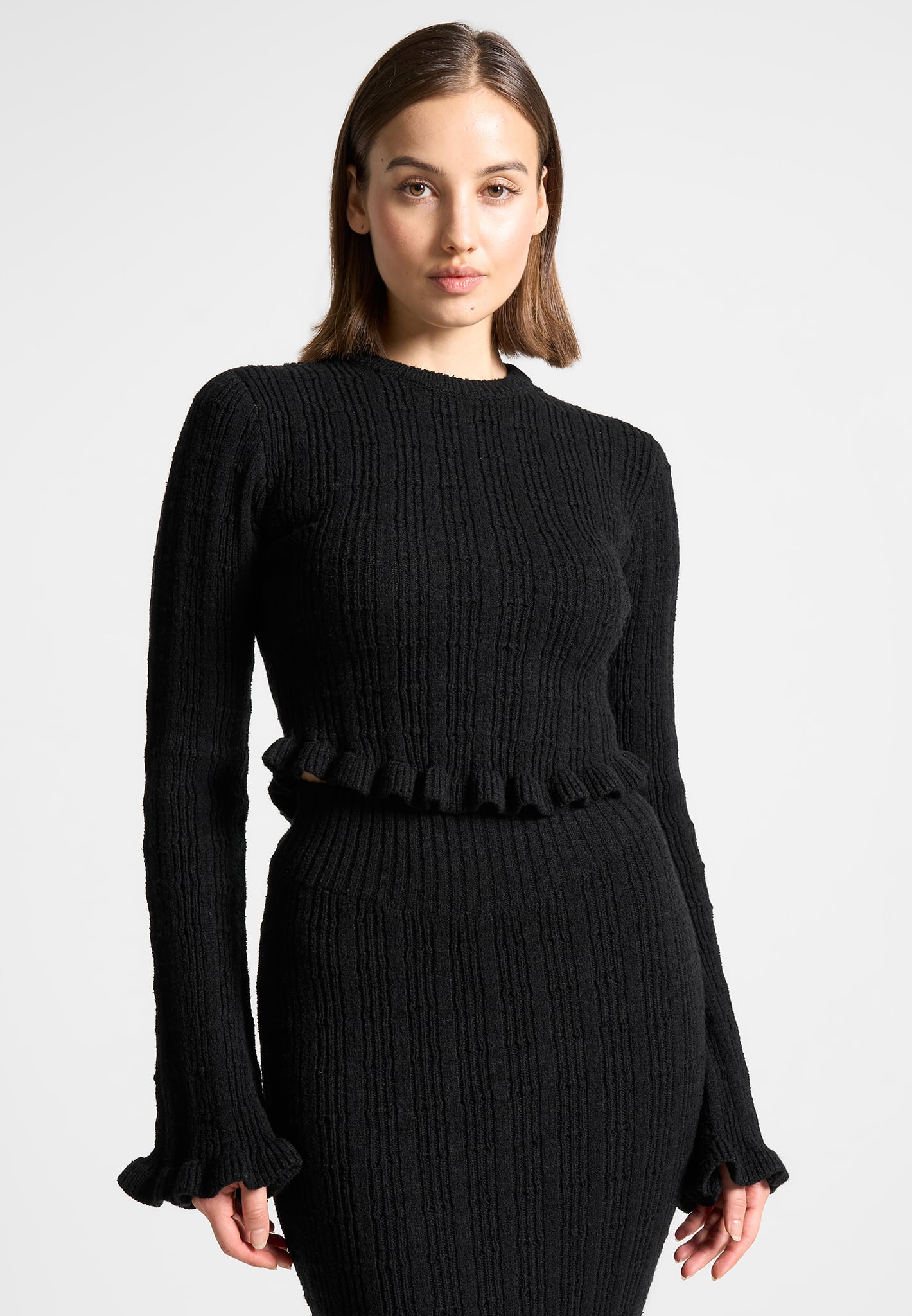 Ruffle Hem Ribbed Knit Top Black Mani re De Voir