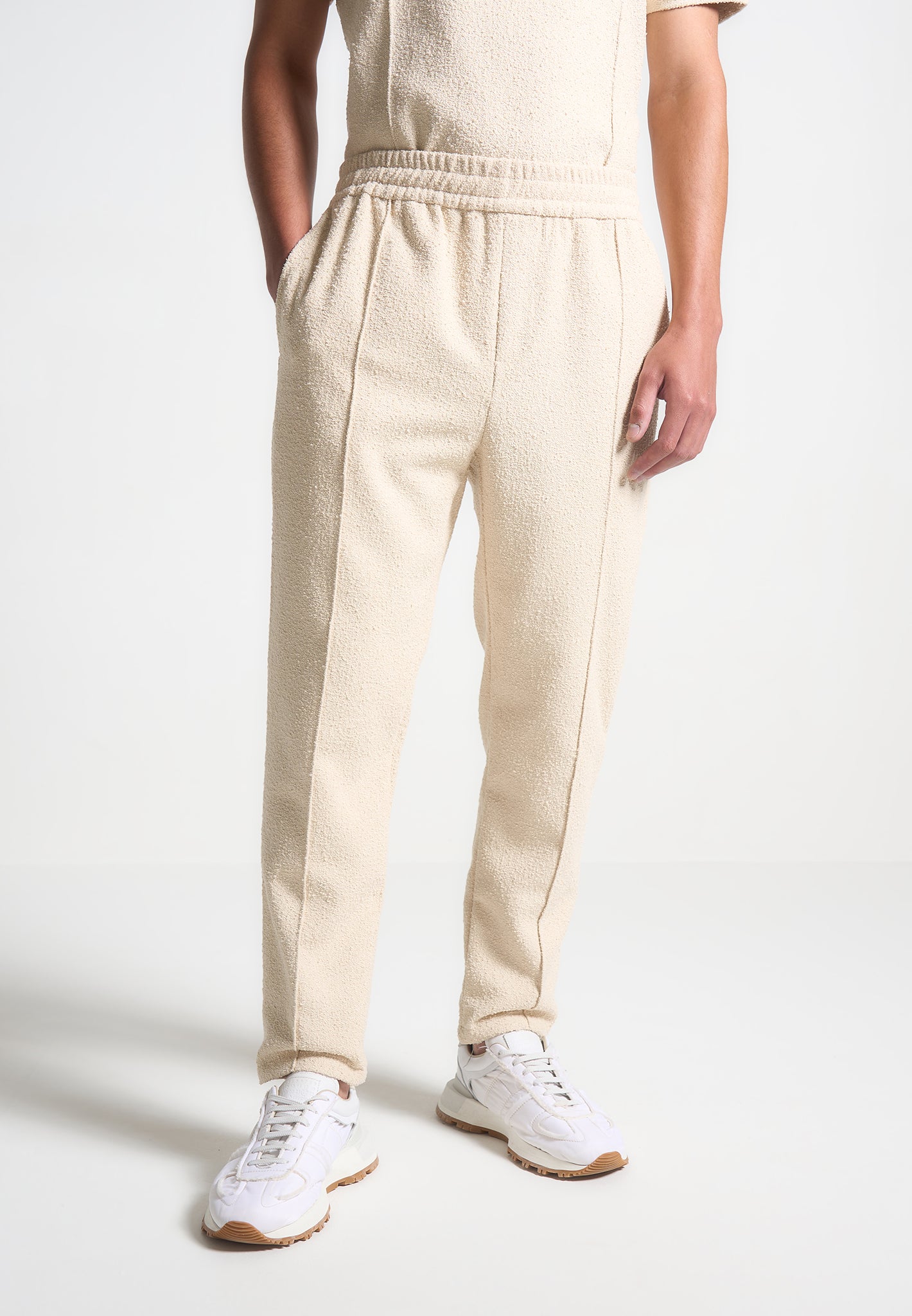 boucle-pintuck-tapered-trousers-beige