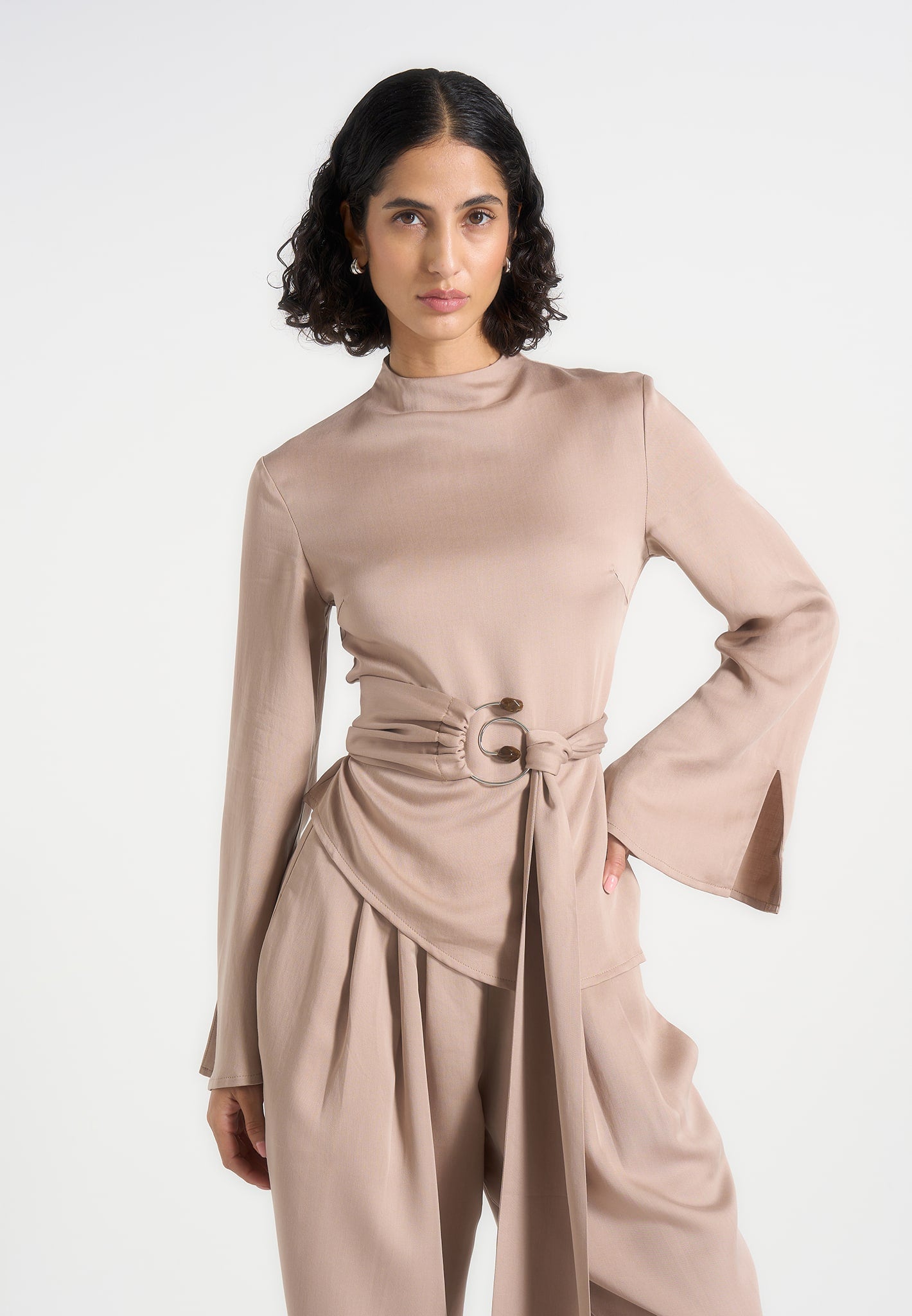 aurore-mock-neck-ring-belt-pleated-leg-jumpsuit-beige