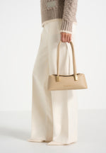 Annelise - Pebbled Leather Baguette Bag - Beige