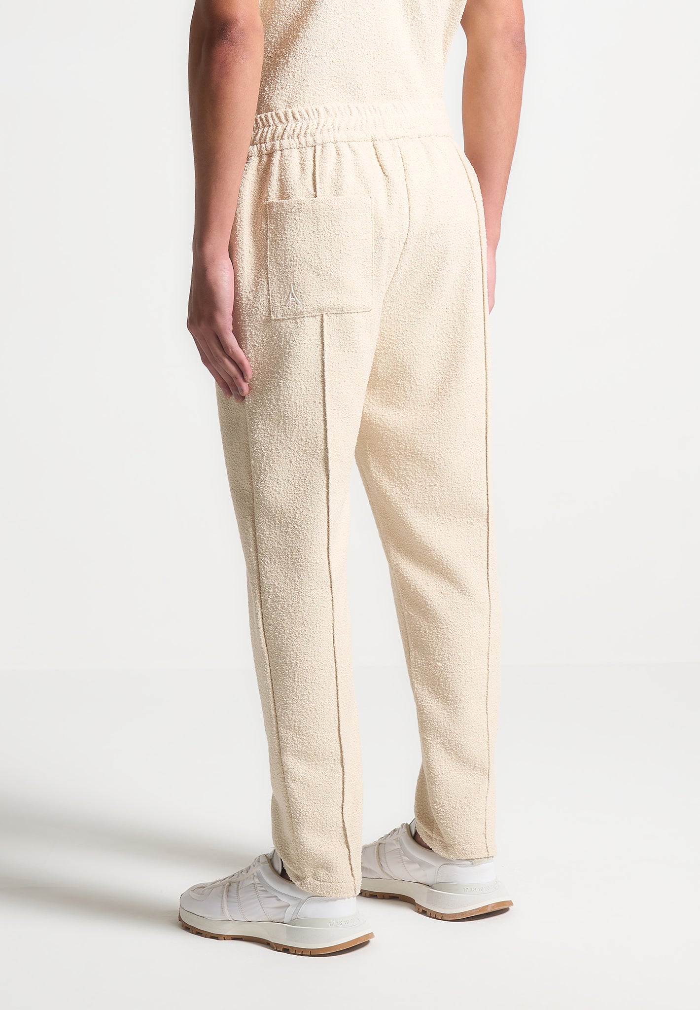 boucle-pintuck-tapered-trousers-beige